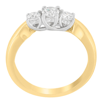 Close-up front angle of a two-toned ring featuring three round white gemstones in prong settings.