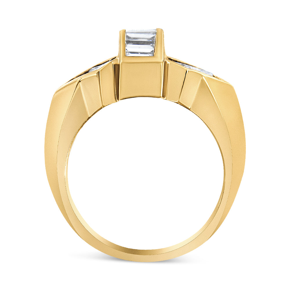 Yellow metal ring shown from the front angle, featuring a central baguette-shaped white gemstone in a channel setting, flanked by princess-shaped white gemstones in an invisible setting along the shoulders.