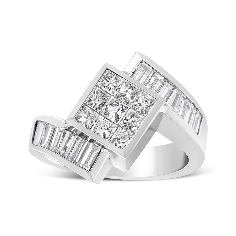White metal ring with a large square cluster of princess cut white gemstones in invisible setting, flanked by two rows of baguette cut white gemstones in channel setting, photographed from a slightly angled side view.