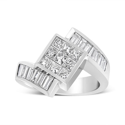 White metal ring with a large square cluster of princess cut white gemstones in invisible setting, flanked by two rows of baguette cut white gemstones in channel setting, photographed from a slightly angled side view.