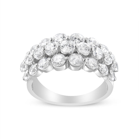 White metal ring with multiple round white gemstones set in two prong settings, shown from front angle.