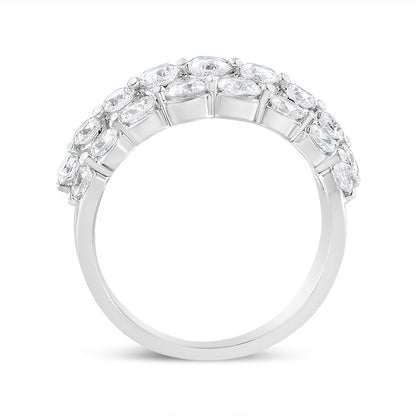 White metal ring with round white gemstones in 2-prong settings, shown in a side profile angle.