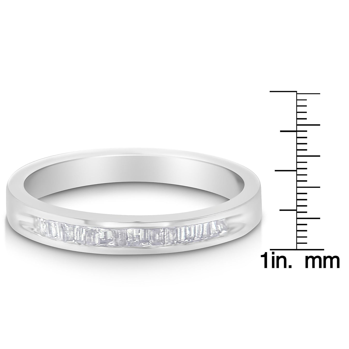 White metal ring with a row of baguette-shaped white gemstones in channel setting, shown at a slight angle next to a ruler for size reference.