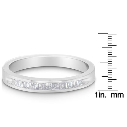 White metal ring with a row of baguette-shaped white gemstones in channel setting, shown at a slight angle next to a ruler for size reference.