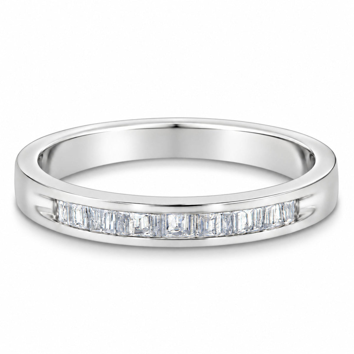 Angled view of .925 sterling silver channel-set stackable band ring showcasing 17 baguette-cut diamonds on white background