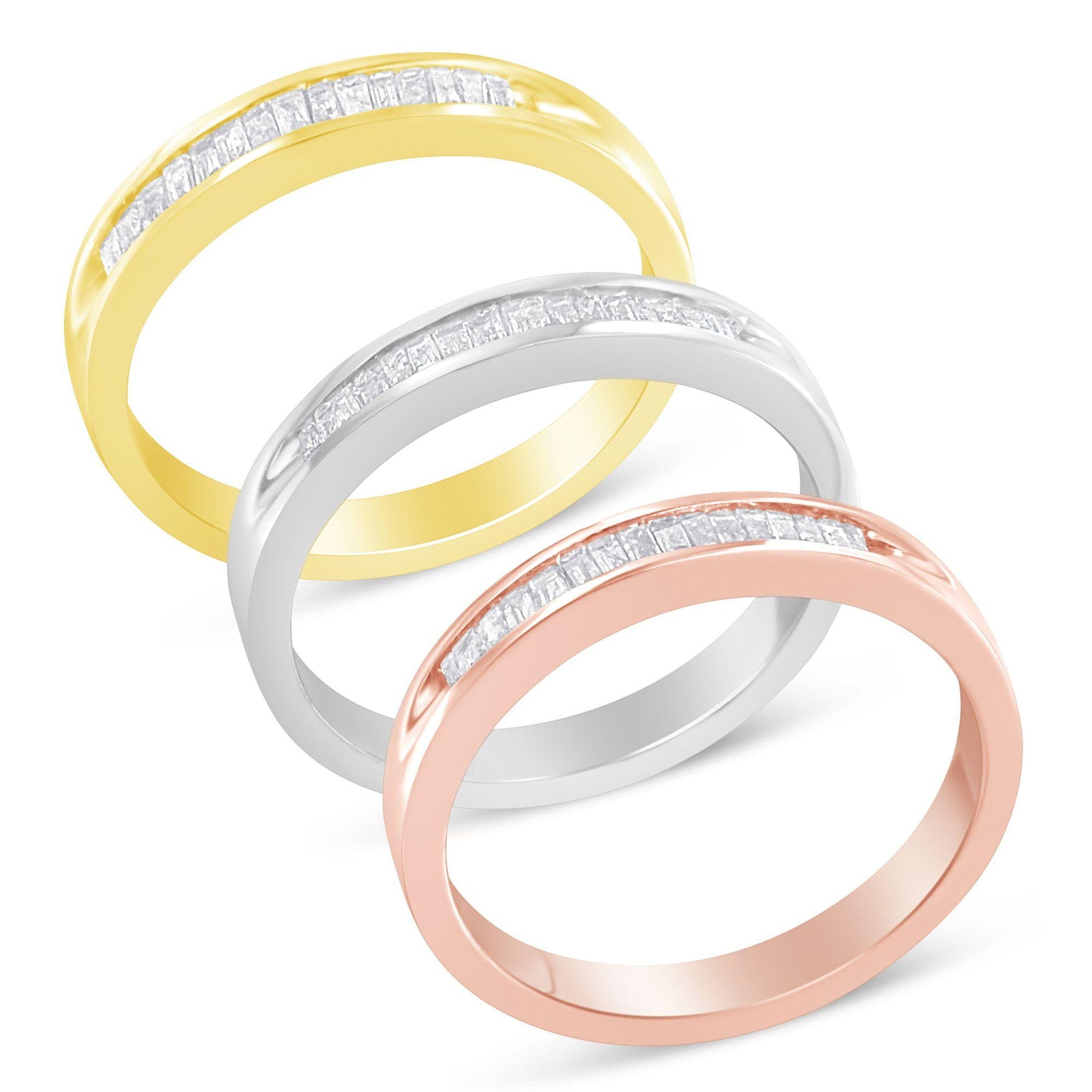 Three rings in yellow, white, and rose metal colors shown in a diagonal stacked arrangement from top left to bottom right, each featuring a channel setting of white baguette-shaped gemstones on the top half, viewed from a slightly angled top-down perspective.