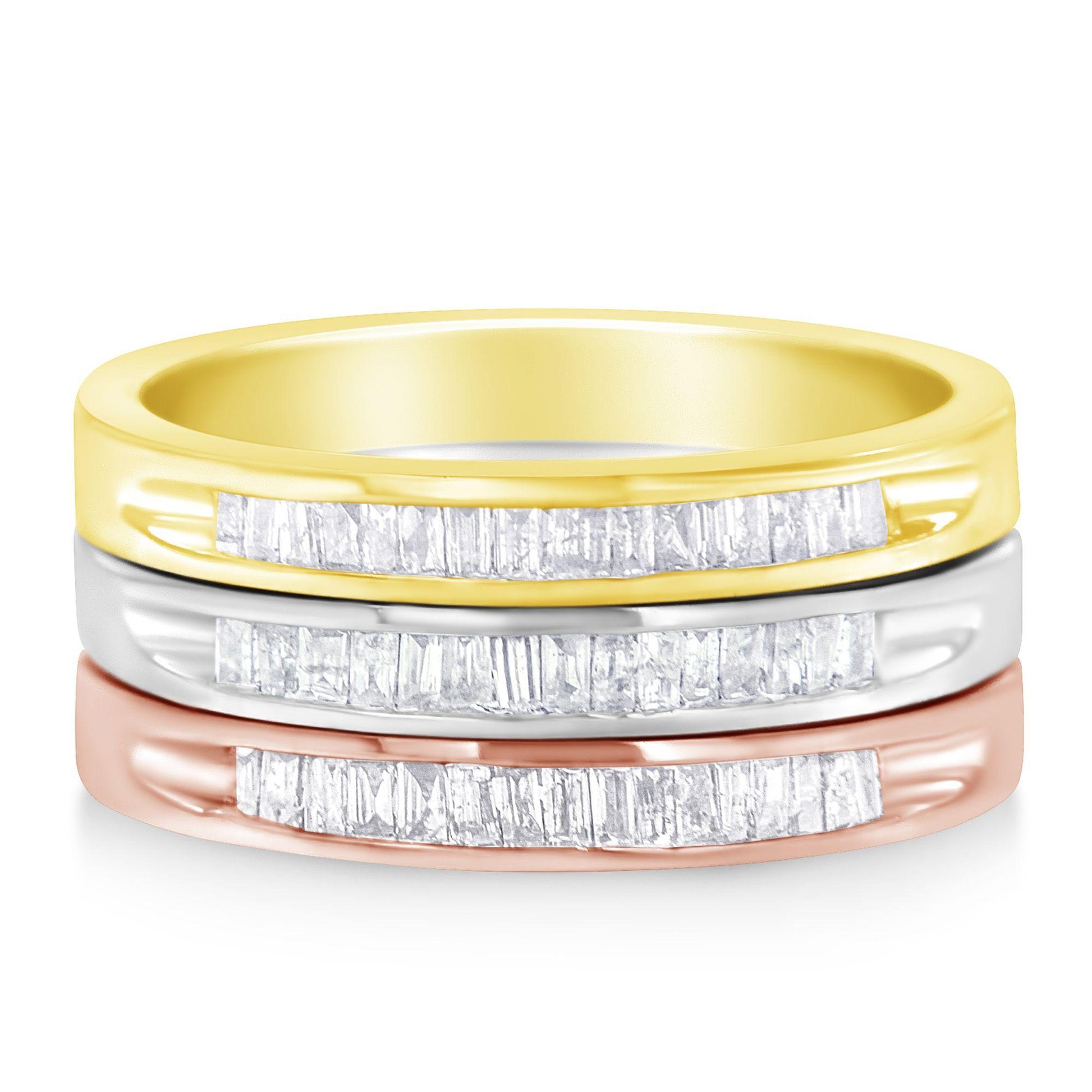 Front-facing stacked view of three rings in yellow, white, and rose metal colors, each featuring a row of white baguette-shaped gemstones set in a channel setting.