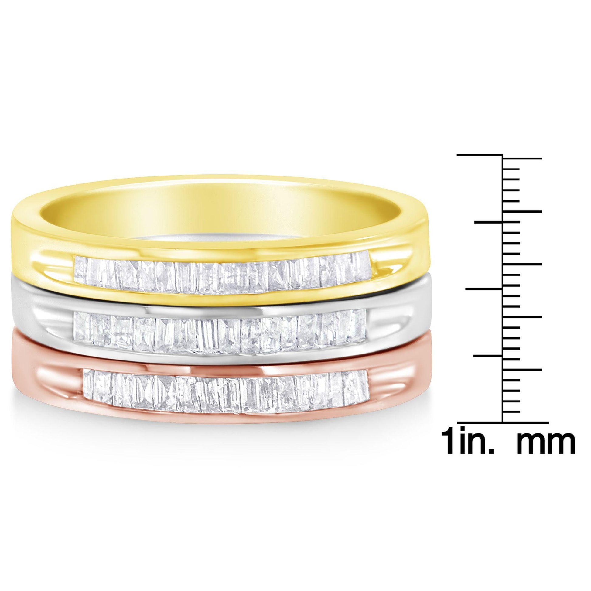 Three stacked rings in yellow, white, and rose metal colors with channel-set white baguette-shaped gemstones, shown from the front with a ruler for size reference.