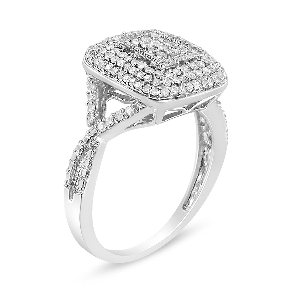 White metal ring with a square cluster of small round white gemstones set in prongs, shown at an angled side view.