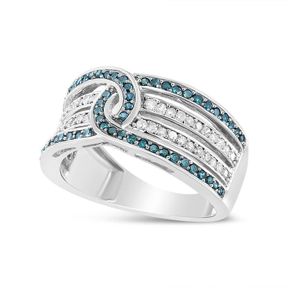 White metal ring shown in a close-up angled view, featuring intertwining bands set with round white and blue gemstones in a pave setting.
