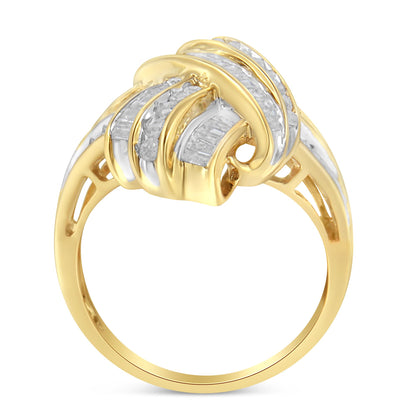 Yellow metal ring with an intricate design featuring white round and baguette gemstones in channel settings, shown from a side angle.