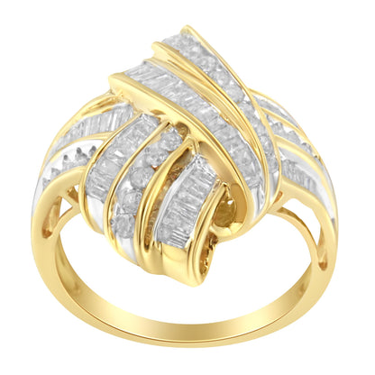 Yellow ring with crisscrossing bands set with white round and baguette gemstones in channel settings, shown from an elevated front angle.