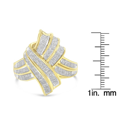 Yellow metal ring with an abstract, flowing design featuring channel-set white round and baguette-shaped gemstones, shown in a front angled view, placed next to a ruler for size reference.