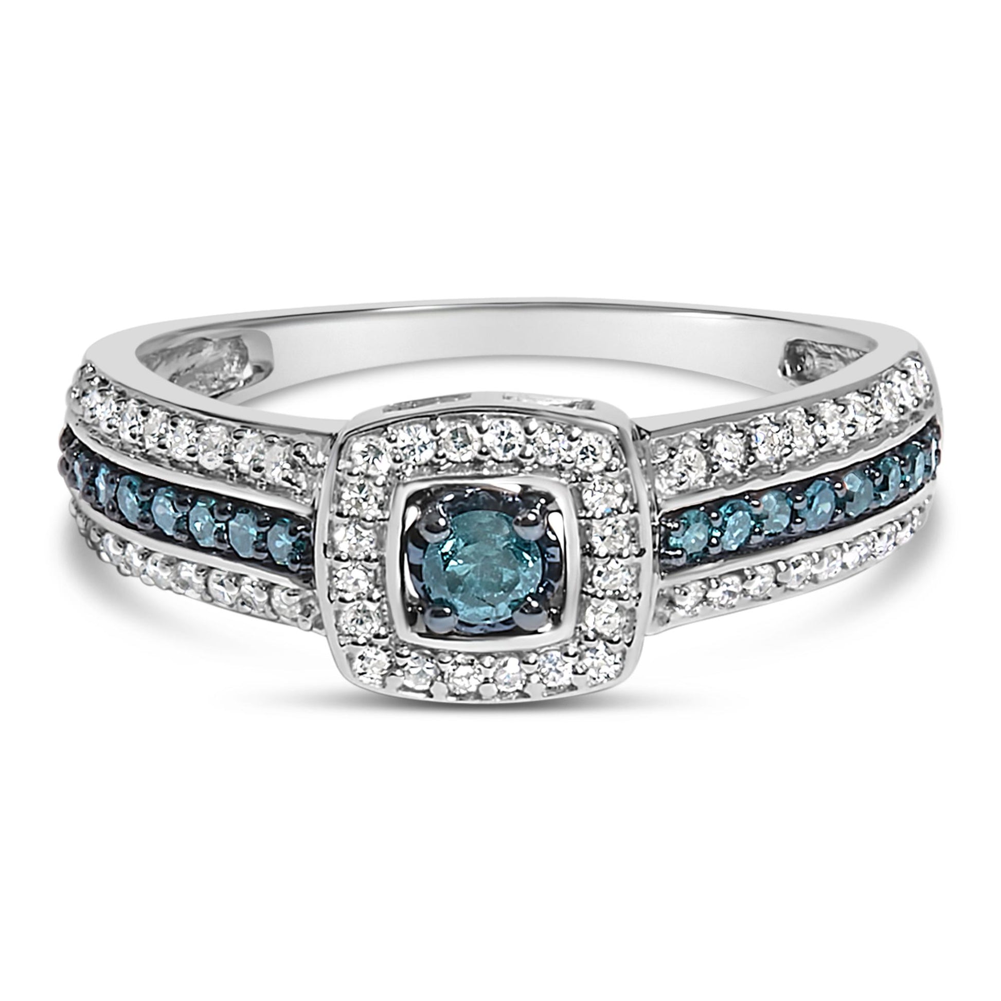 Front-facing close-up of a white metal ring with one blue round gemstone center in prong setting, surrounded by white round gemstones, and a band featuring rows of blue and white round gemstones in prong settings.
