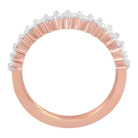 Close-up, top-down view of a rose-colored ring featuring a row of white princess-shaped gemstones in prong settings along the top half of the band.