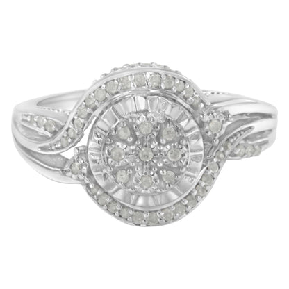 Front-facing view of a white metal ring featuring round white gemstones in a prong setting forming a circular cluster design with an elegant swirl detail.
