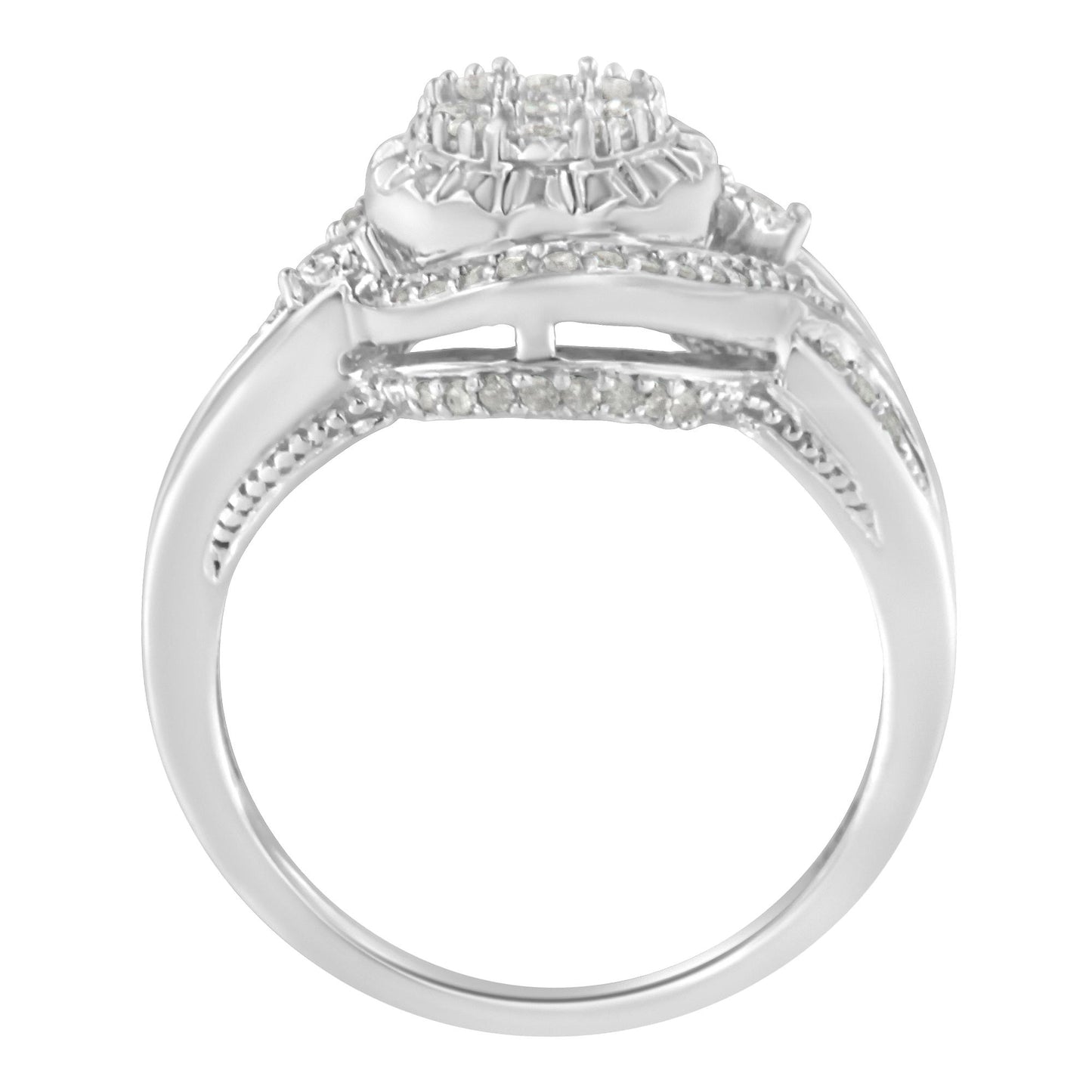 White metal ring with a cluster of round white gemstones in prong settings on top, viewed from the side angle.