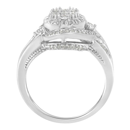 White metal ring with a cluster of round white gemstones in prong settings on top, viewed from the side angle.