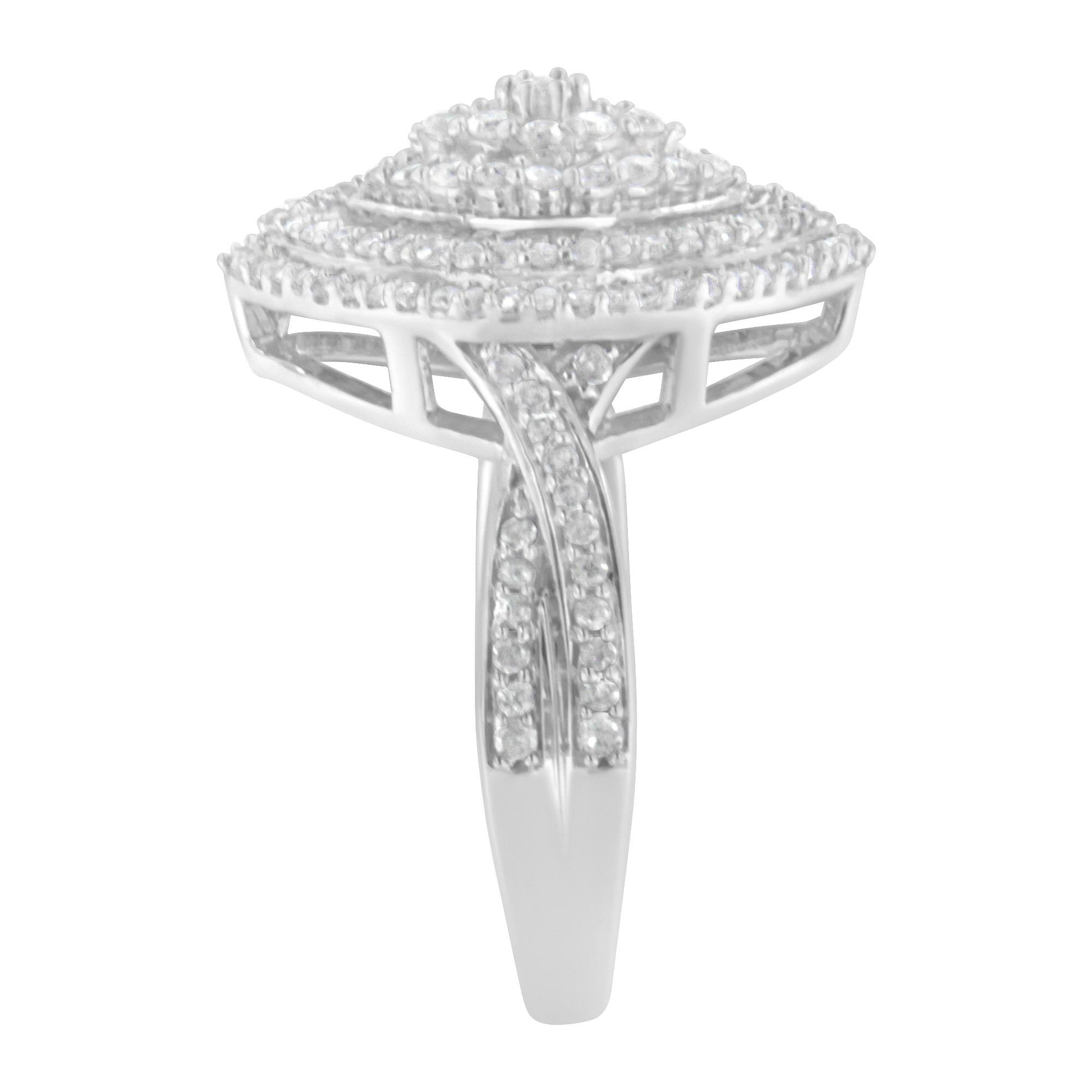 Front view of a white metal ring featuring an elevated square-shaped cluster design with multiple round white gemstones in prong settings and baguette-shaped white gemstones in channel settings along the band.