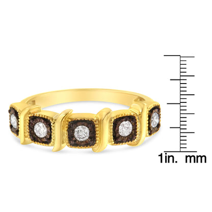 Yellow and black ring with round white gemstones in miracle setting, shown at slight angle, placed next to a ruler for size reference.