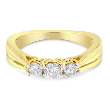Yellow metal ring with three round white gemstones in prong setting, front-facing angle.