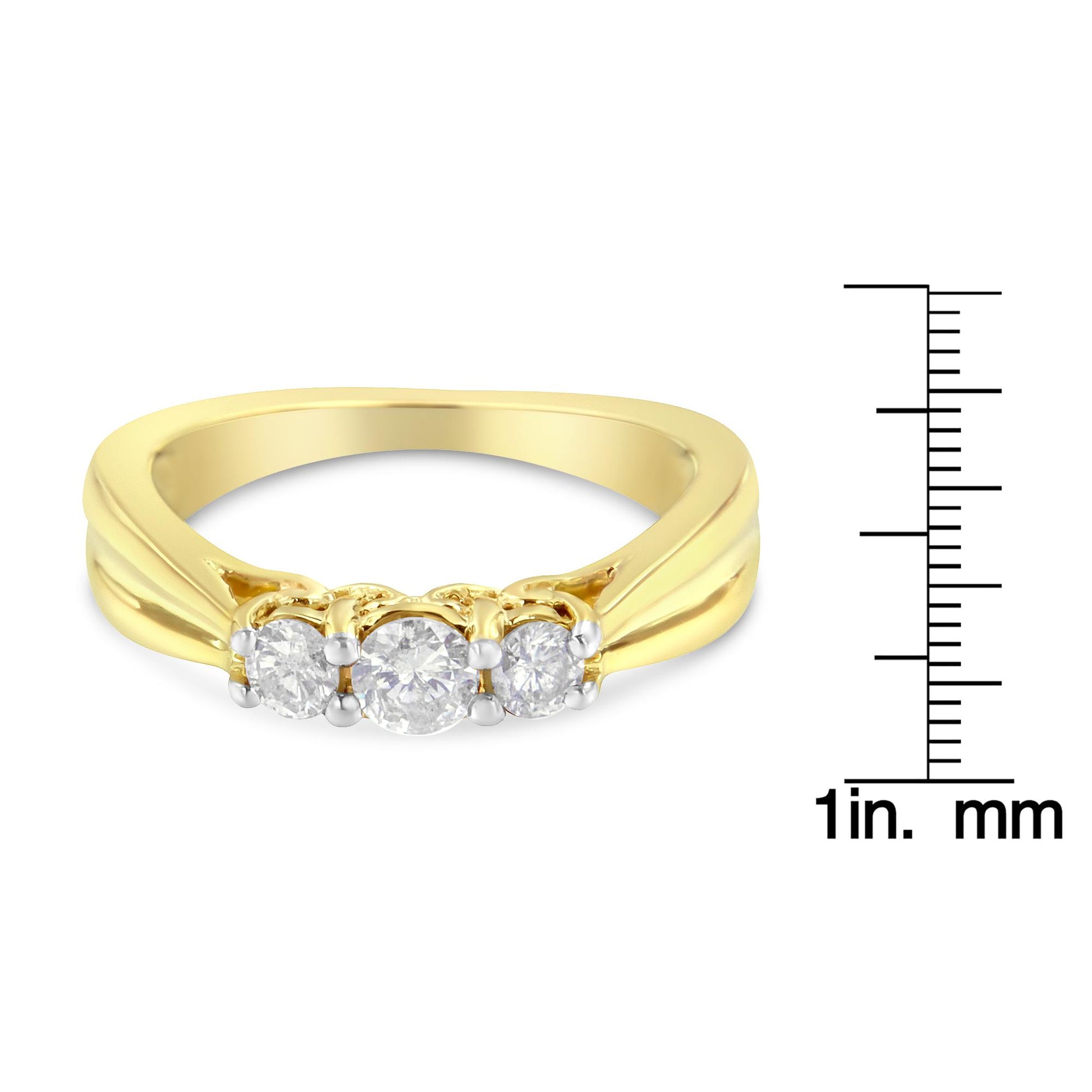 Front angle of a yellow ring with three round white gemstones in prong settings, shown next to a ruler for size reference.