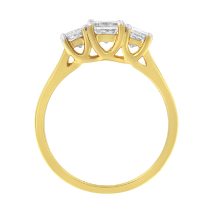 Yellow metal ring with three white princess-shaped gemstones in prong settings, shown in a side profile view.