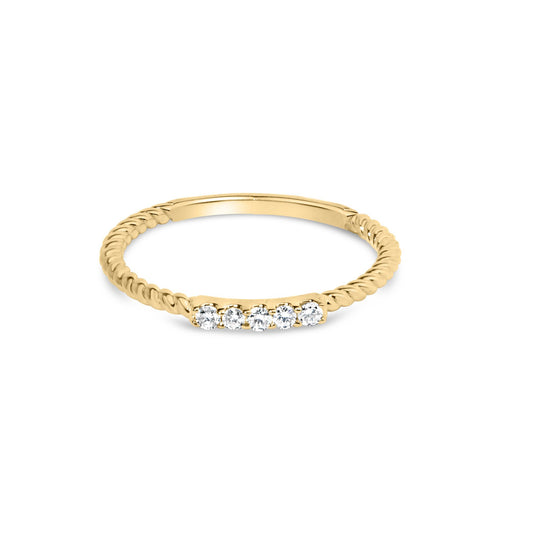 Yellow twisted band ring with a row of round white gemstones in prong settings, shown from a front angle.