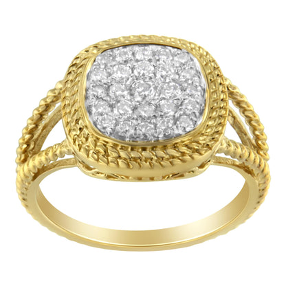 Front angle view of a yellow metal ring with a square cluster of round white gemstones in prong setting and a braided band design.