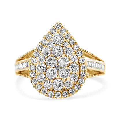 Front-facing view of a yellow metal ring with a pear-shaped cluster of white round gemstones in prong and pave settings, surrounded by a border of similar round gemstones, and accented with white baguette gemstones in channel settings along the split shank.