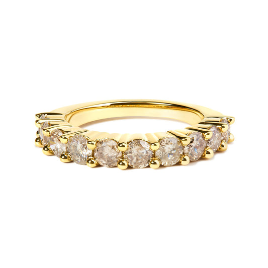 Close-up front angle of a yellow ring featuring a row of round white gemstones in a shared prong setting.