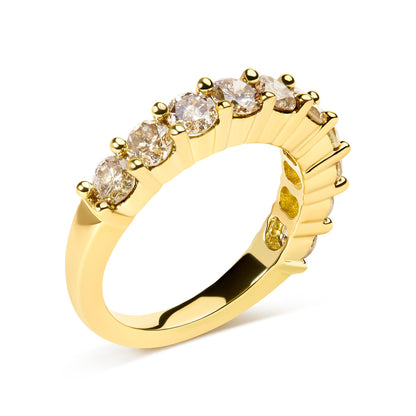 Close-up angled shot of a yellow ring featuring a row of round white gemstones in a shared prong setting.