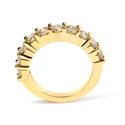 Yellow metal ring with round white gemstones in shared prong setting, shown from a side angle.