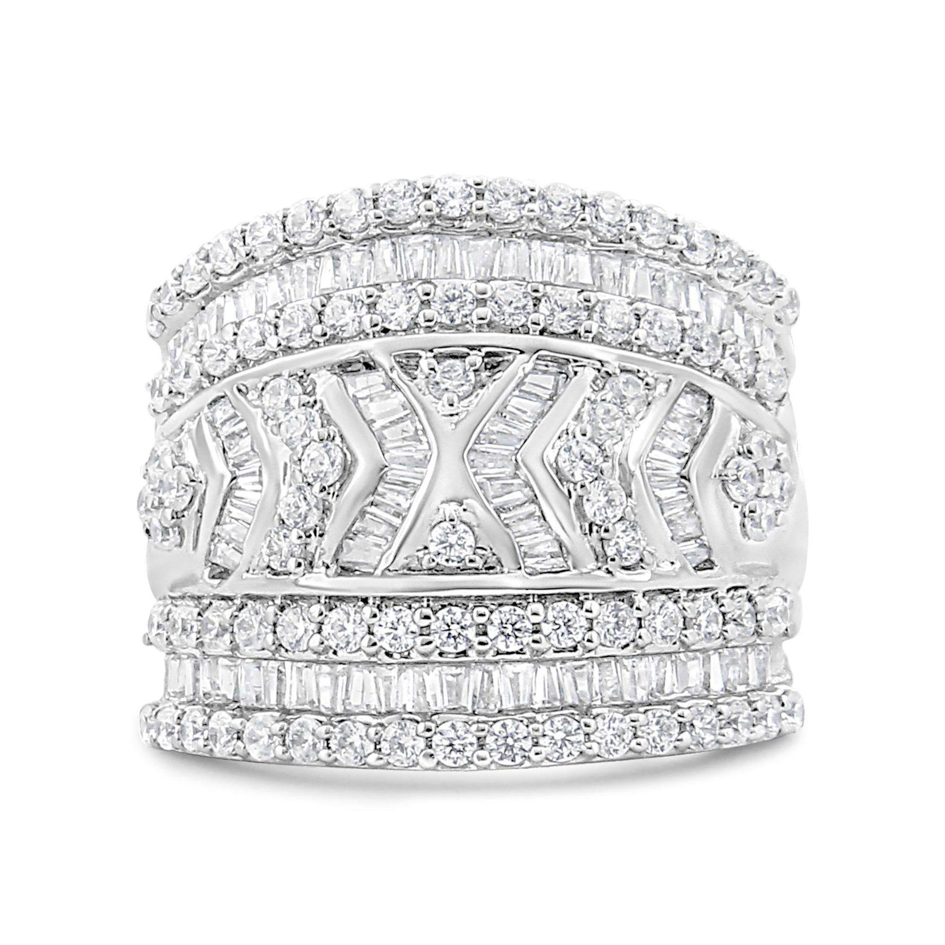 Front view of a wide white metal ring featuring multiple rows of round and baguette-shaped white gemstones in prong and channel settings with chevron and floral-inspired detailing.