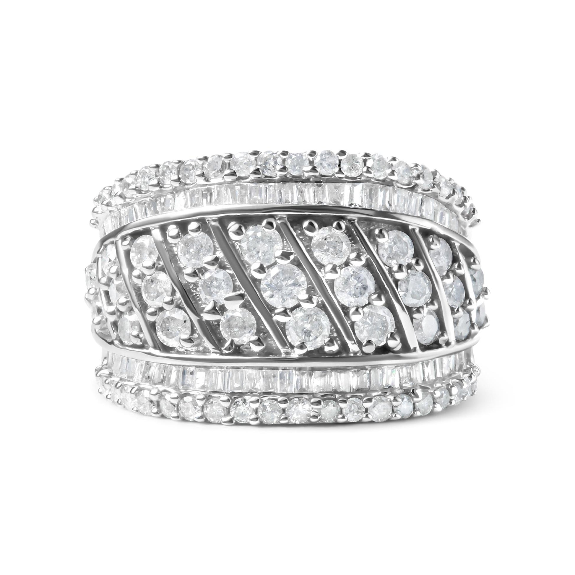 Close-up front view of a wide white metal ring featuring multiple rows of round and baguette-shaped white gemstones in prong and channel settings.