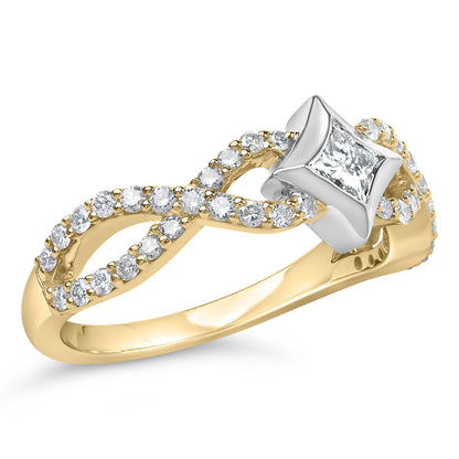 Close-up angled shot of a yellow and white metal ring featuring a princess-shaped white gemstone in a channel setting at the center and multiple round white gemstones in prong settings along the band in an infinity design.