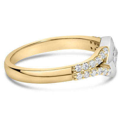 Side angle of a two-tone ring with a white gemstone in a princess shape set in a channel setting, accompanied by multiple round white gemstones in prong settings along the yellow band.
