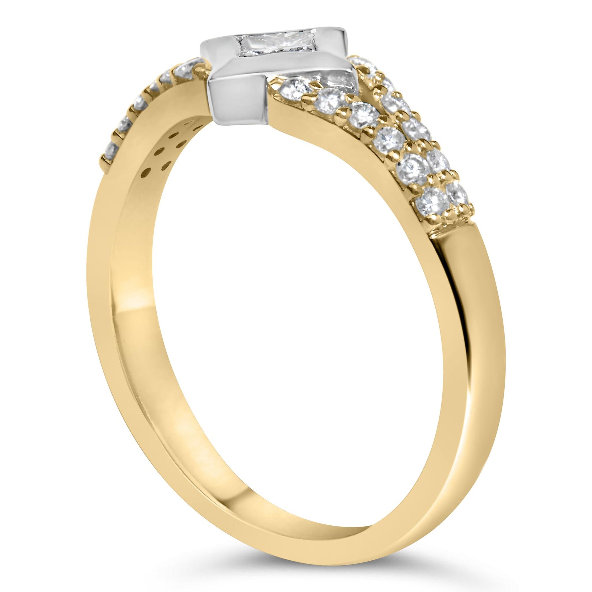 Ring with yellow and white metal, featuring a princess shape white gemstone in a channel setting and multiple round white gemstones in prong settings, shown at an angled side view.