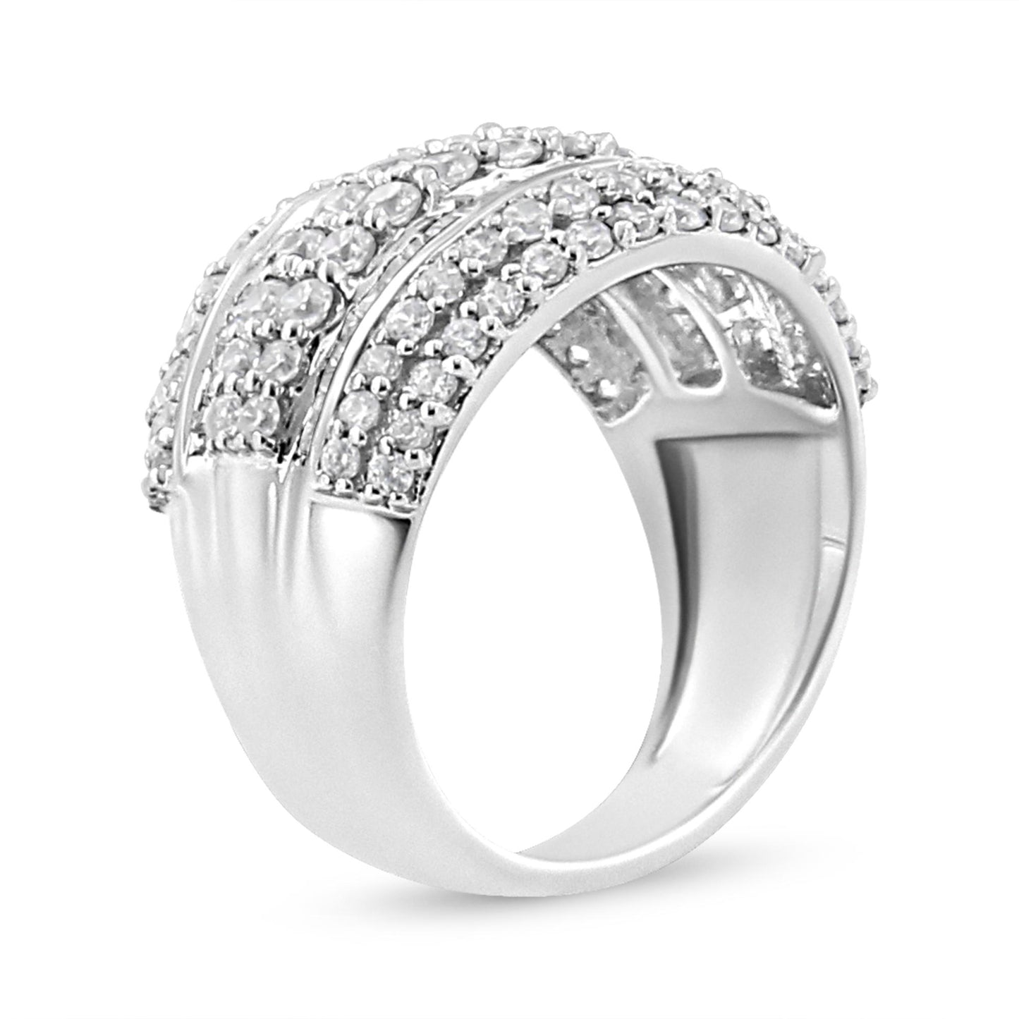 White metal ring with two rows of round white gemstones in prong settings and two rows of baguette white gemstones in channel settings, shown from a side angle.