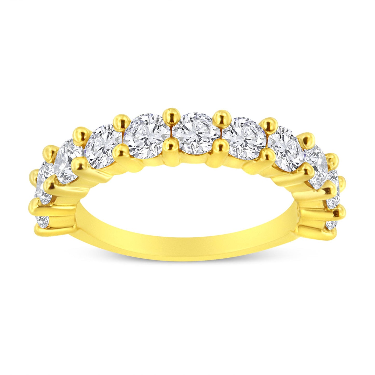 Yellow metal ring with round white gemstones in prong settings viewed from a side angle.