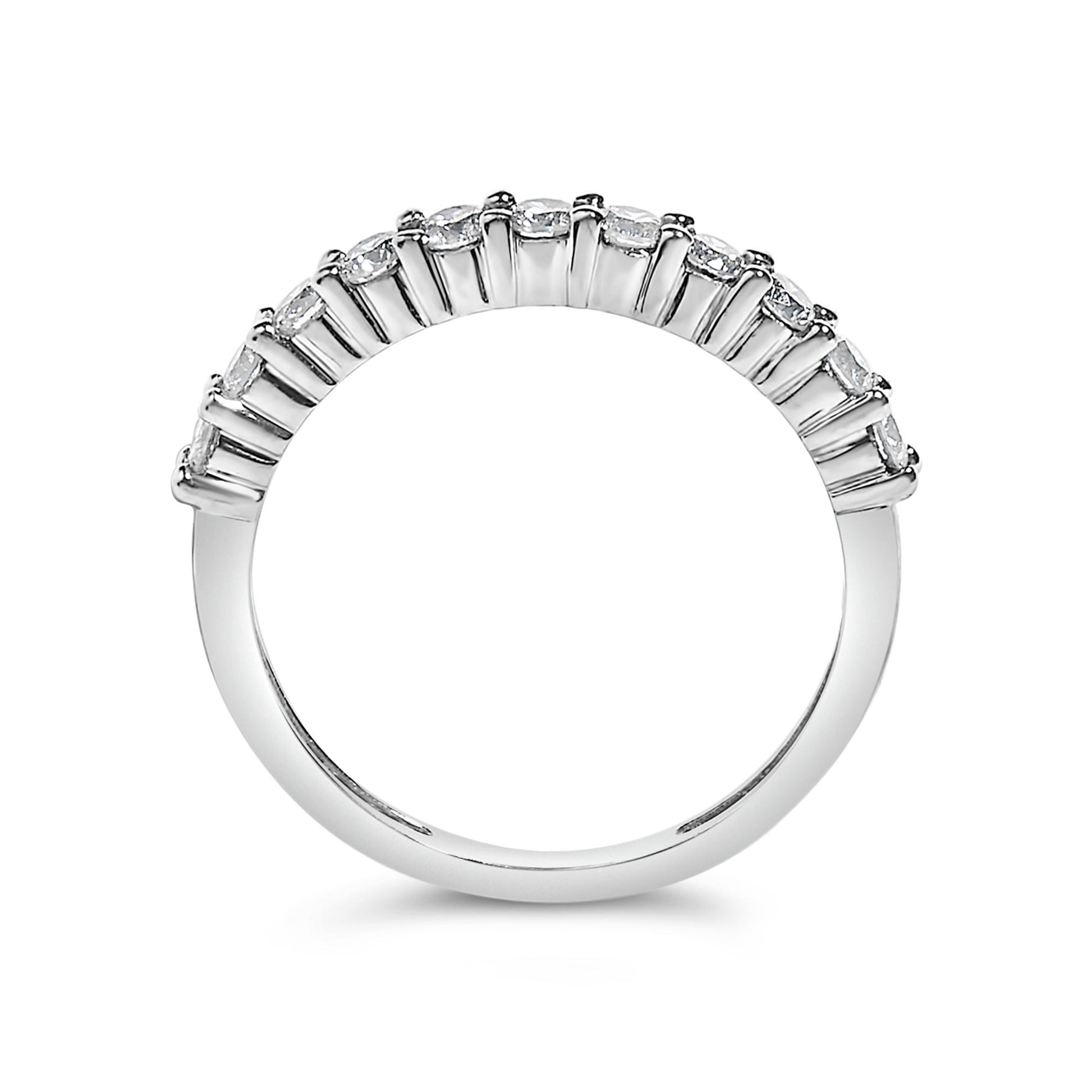 Close-up front view of a white metal ring featuring a curved row of round white gemstones set with prongs along the top.