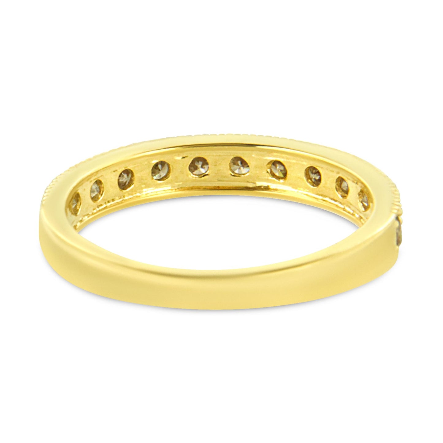 Yellow metal ring with round white gemstones set in a pave style visible from an angled side view.