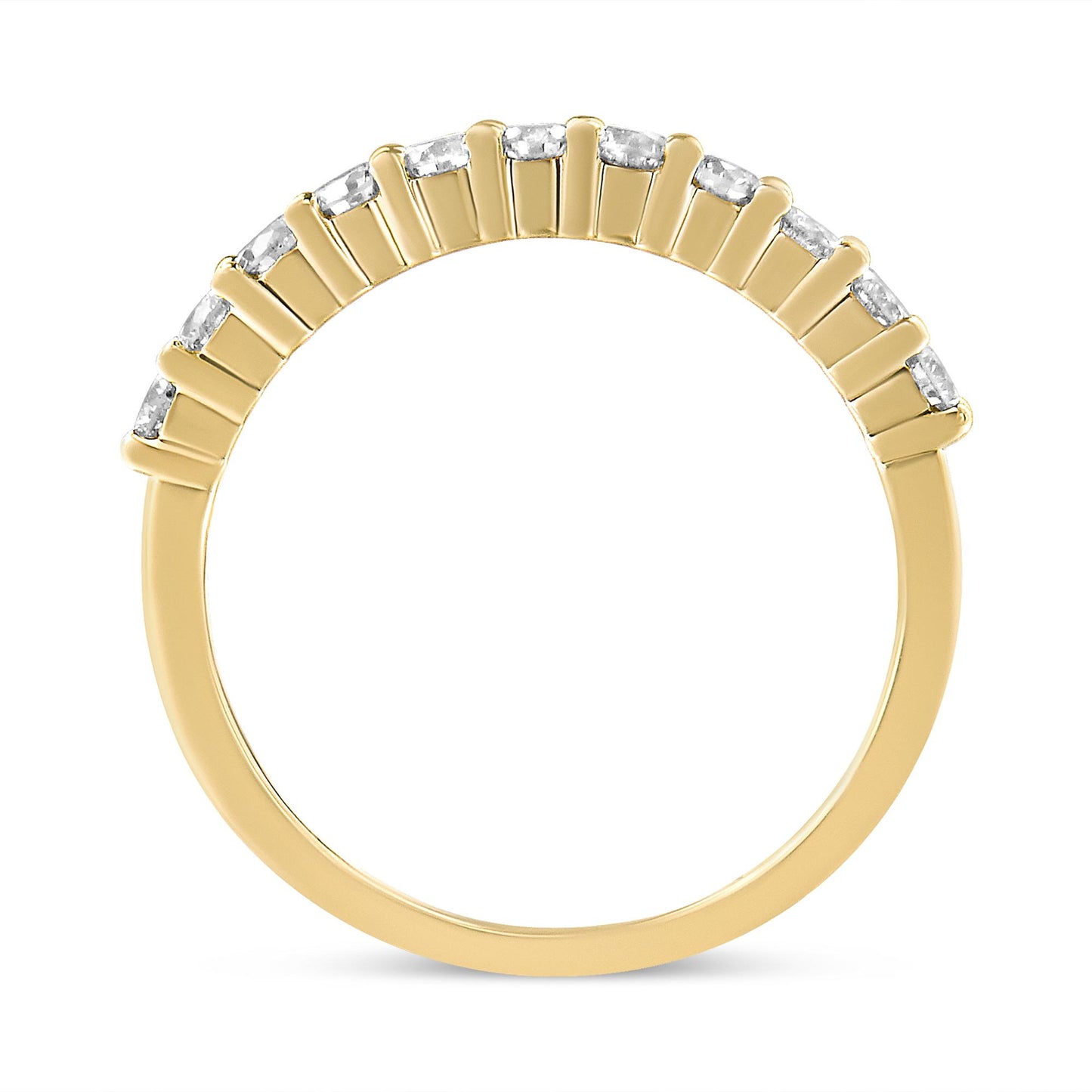 Close-up front view of a yellow metal ring set with a row of round white gemstones in prong settings along the band top.