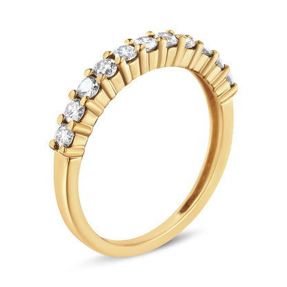 Close-up angled view of a yellow ring featuring a row of round white gemstones in prong settings along the band.