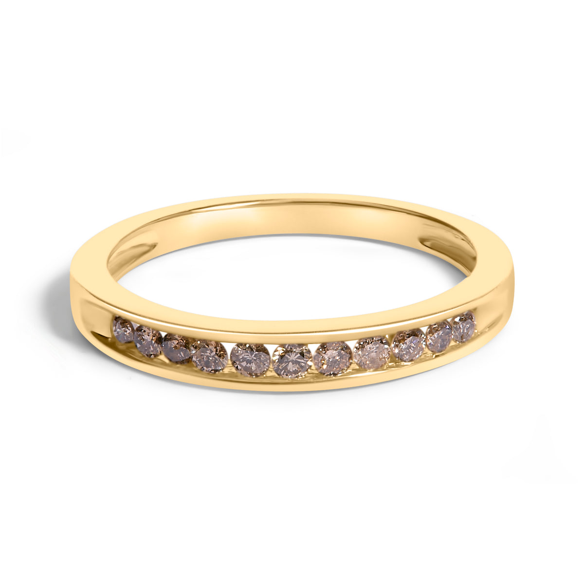 Close-up top front angle of a yellow ring with a channel setting of round white gemstones.