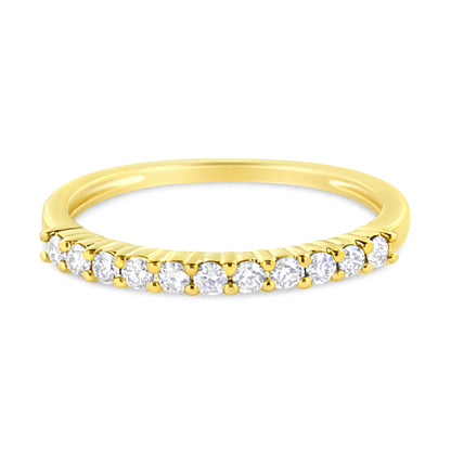 Yellow metal ring shown from a slightly elevated front angle, featuring a row of round white gemstones in prong settings along the band.