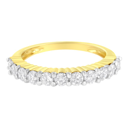 Yellow ring with a row of round white gemstones in shared prong setting, shot from a slightly elevated front angle.