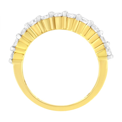 Yellow metal ring with a row of round white gemstones in shared prong setting, side view on a white background.