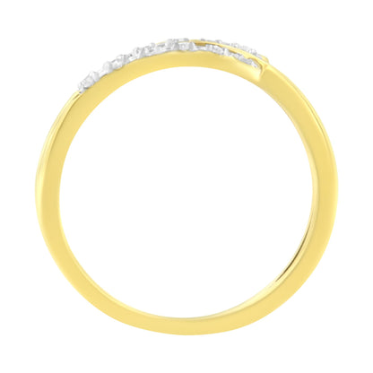 Top view of a yellow ring with a row of white round gemstones in prong settings along the top edge.
