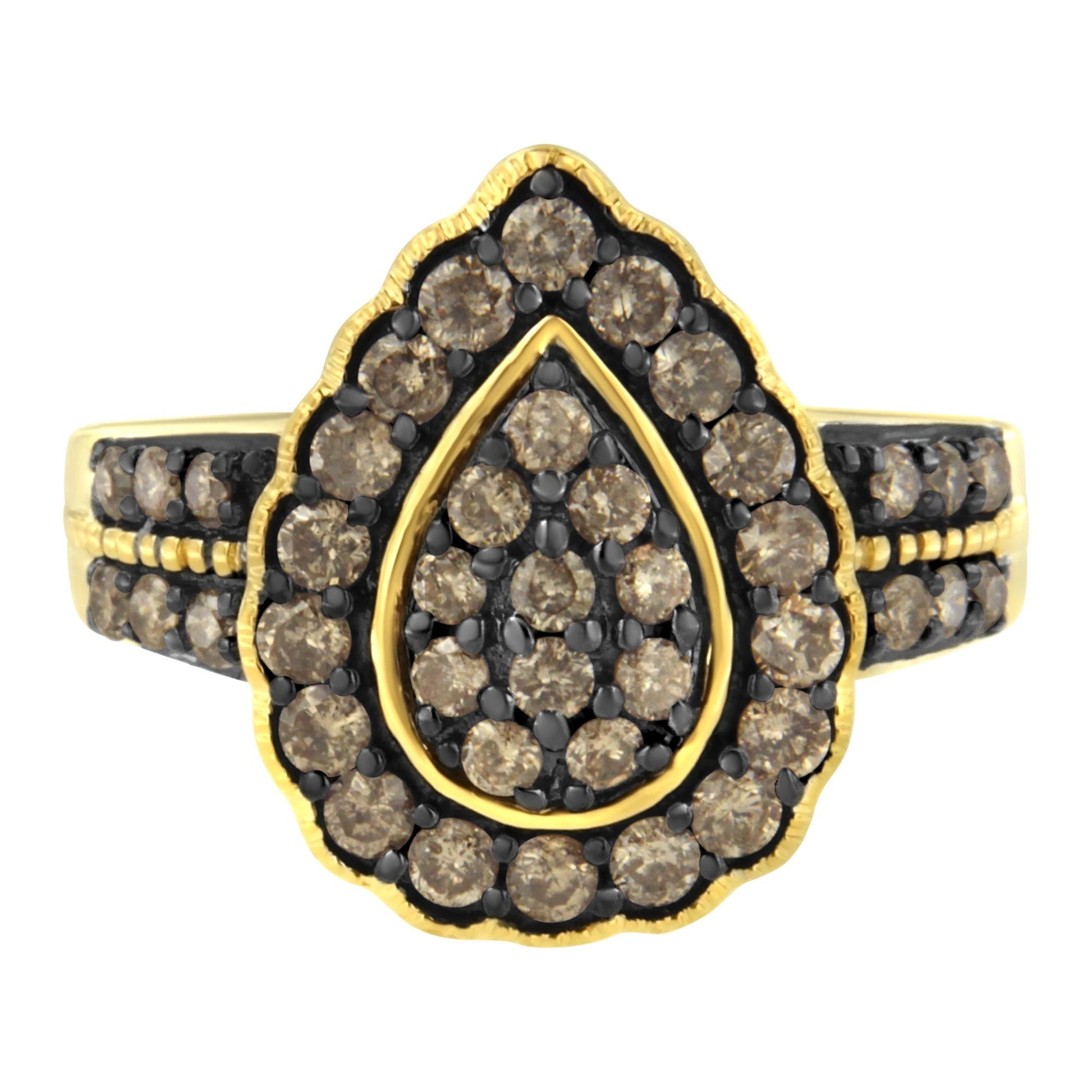 Front angled close-up of a yellow and black ring with round white gemstones in prong settings forming a teardrop-shaped cluster on top.